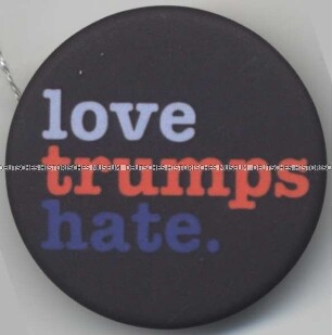 Button "love trumps hate."