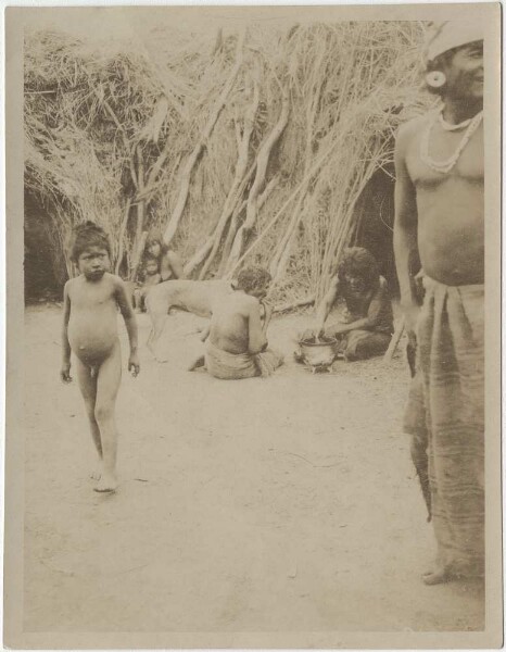 Ashluslay Indians from the Rio Pilcomayo in front of a hut