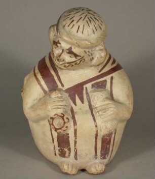 Sitzende anthropomorphe Figurr mit "Dipper" und Matte