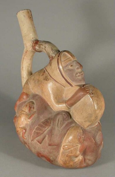 Relief: anthropomorphic and zoomorphic figures with drum