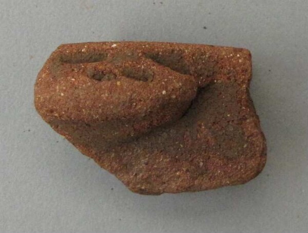 Rim sherd of a clay vessel