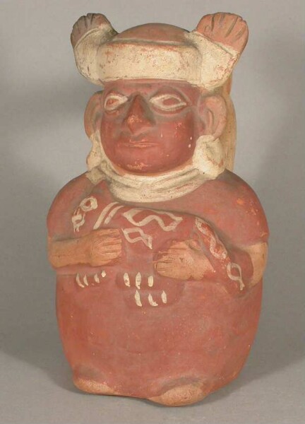 Standing anthropomorphic figure with felids in his arms