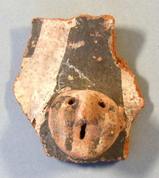 Clay head (fragment of a burial urn)