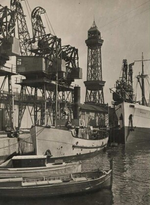 Barcelona. Im Hafen. Krane zum Be- und Entladen der Schiffe. Im Hintergrund der gusseiserne Turm, Torre Jaume I. der Hafenseilbahn