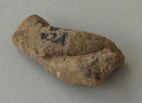 Fragment of a clay vessel decoration