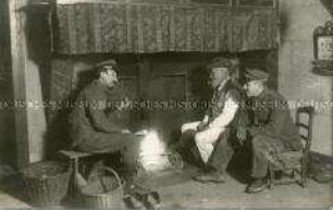 Soldaten und Bauer am Kamin