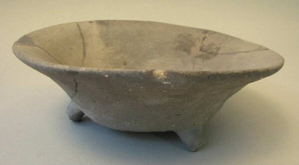 Three-footed clay bowl