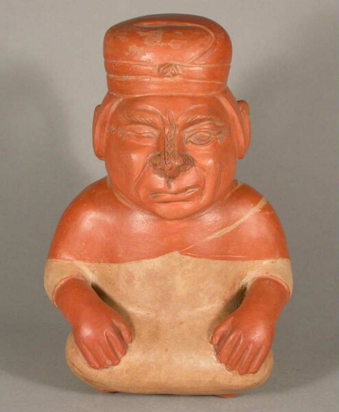 Seated anthropomorphic figure with facial paralysis