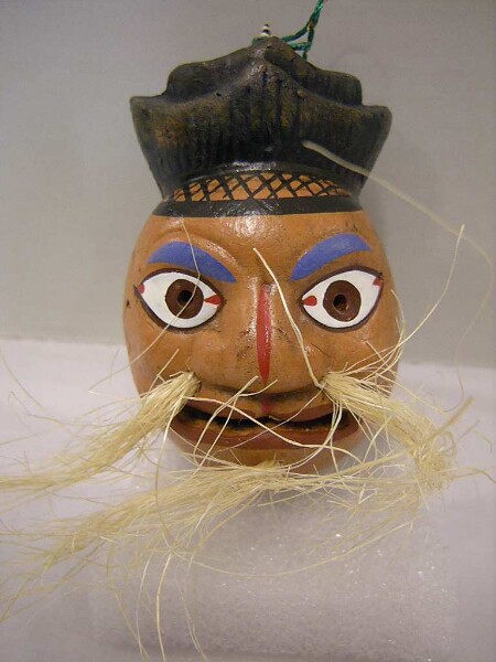 Bell in the shape of a miniature mask