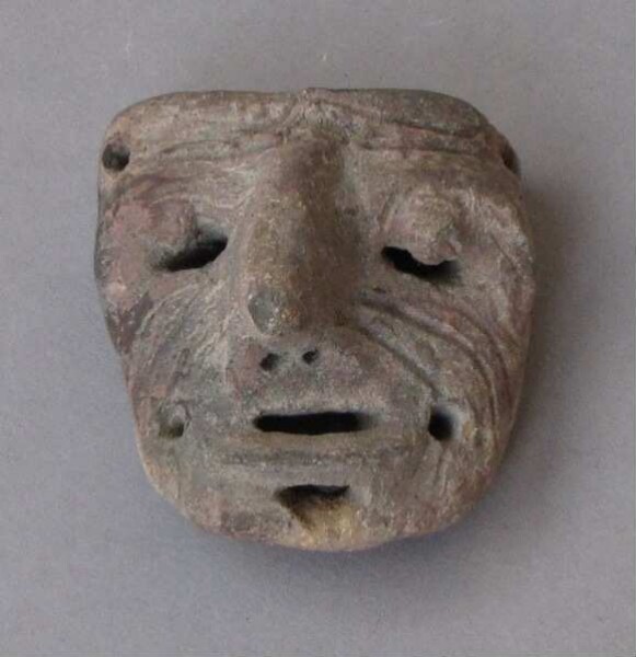 Clay head (fragment)