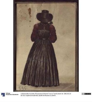 Rückenansicht einer Frau in Tracht