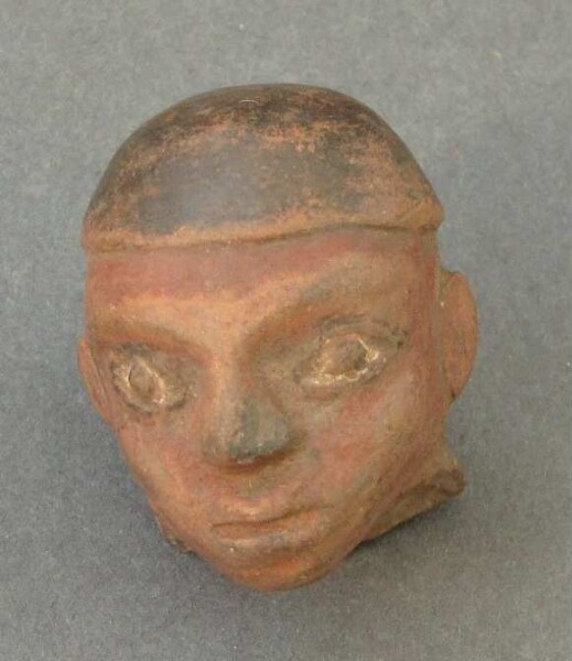 Clay vessel (clay head, fragment)