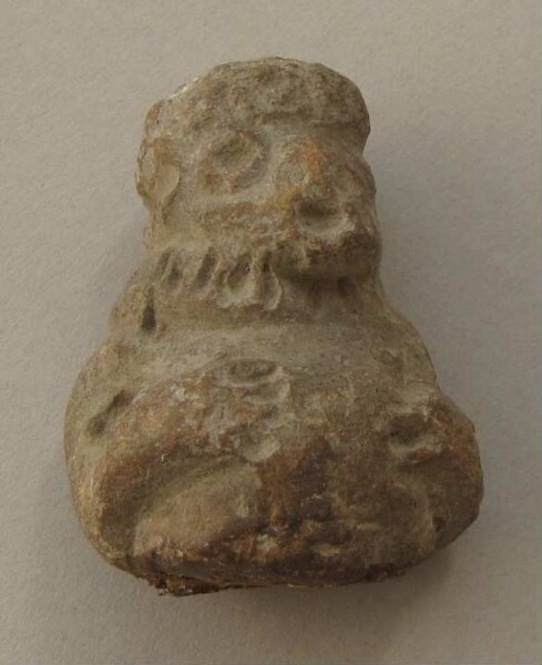 Upper body with head of a clay figure