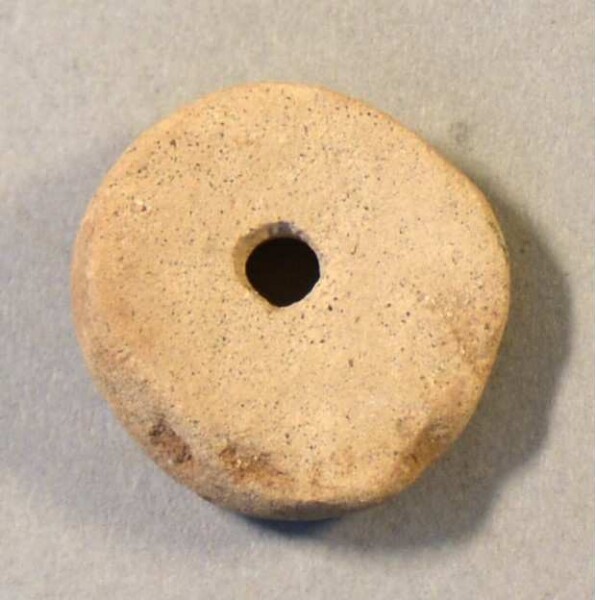 pierced stone disc