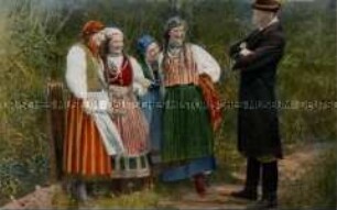 Mann und Frauen in polnischer Volkstracht
