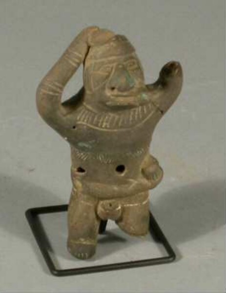 Clay ocarina in the shape of a male figure