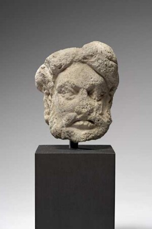Kopf eines Mannes mit Vollbart und Turban