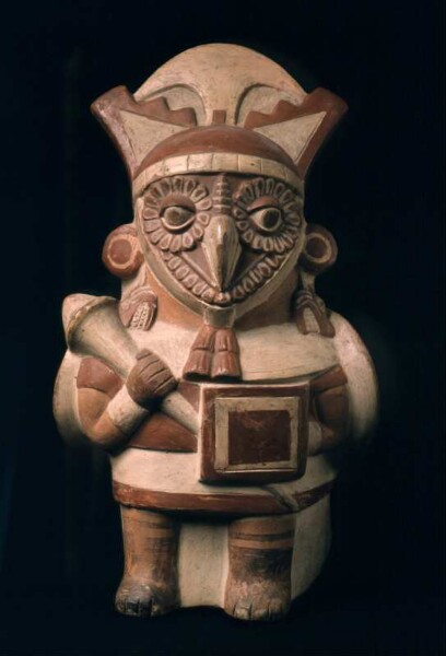 Standing anthropo-zoomorphic figure (bird/owl) with club and shield