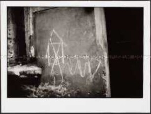 Graffiti an einer Wand (Altersgruppe 18-21)