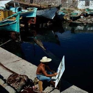 Lesbos, Mithymna. Kastron. Athener Akademieschüler malt im Hafen