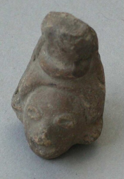 Fragment of a clay rattle (clay head)