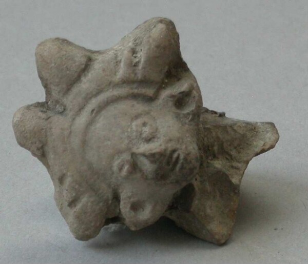 Fragment of a clay rattle (clay head)