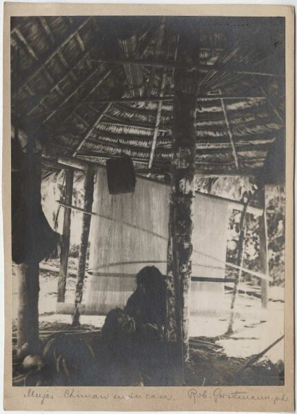 Chimane woman with child in her hut