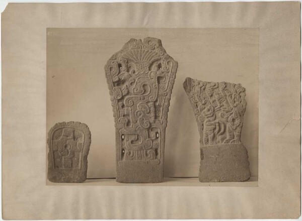 Three stone figures, relief backs