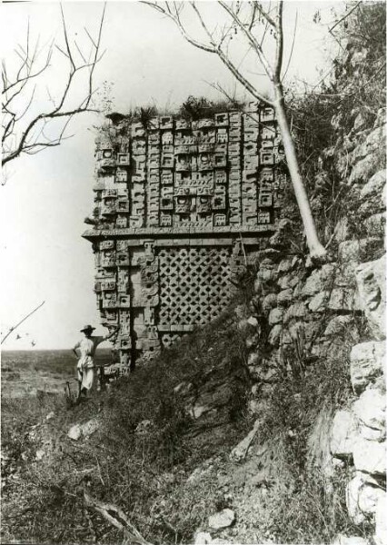 "Partial view of the 'Pirámide del Adivino' (fortune-telling pyramid). The main temple. The pre-temple on the west side of the 3rd body. South view. 4th body, west façade. (With expedition member)."