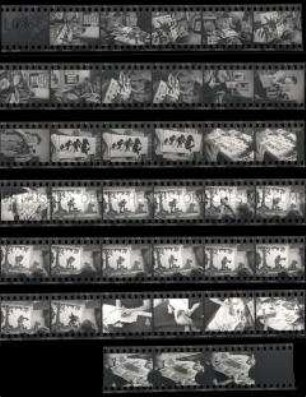 Schwarz-Weiß-Negative mit Aufnahmen der Scherenschnittmeisterin Lotte Reiniger bei der Arbeit in ihrem Atelier