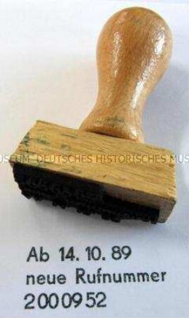 Stempel zur Ankündigung einer neuen Telefonnummer