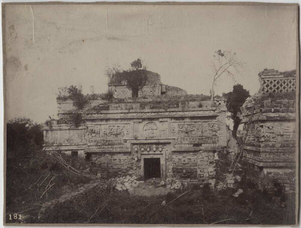 East wing of the nunnery. La Iglesia on the right. (With expedition member.)