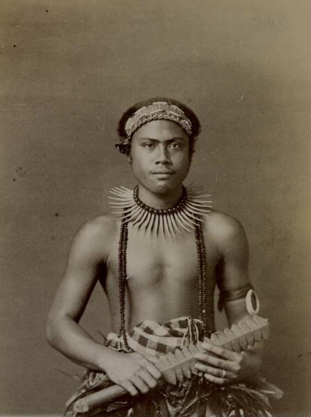 "Man with head and arm jewellery, tools in hand, Samoa-Ins."