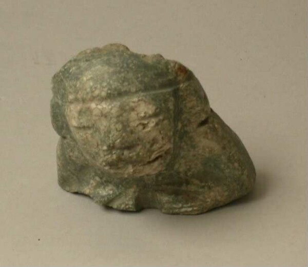 Upper part of a stone figure