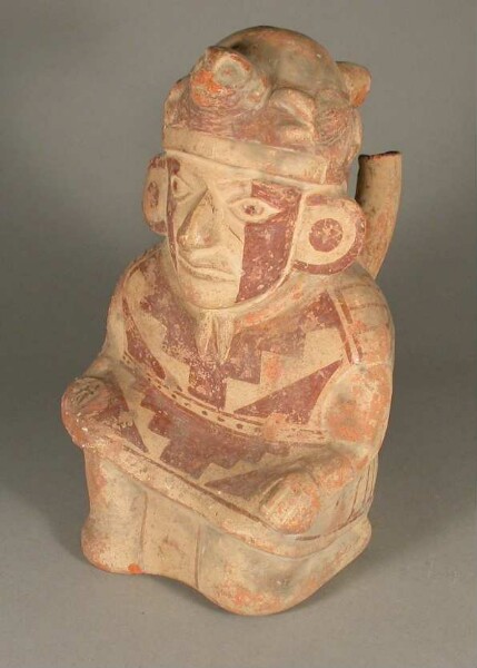 Kneeling anthropomorphic figure