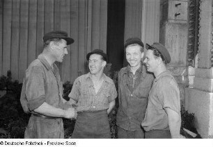 Vier lachende Mitglieder der Brigade Bleichert