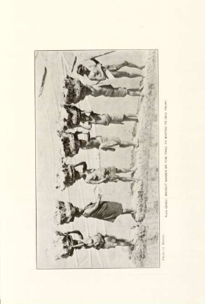 Plate CXXIV. Mayinit women on the trail to Bontoc to sell palay