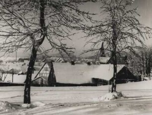 Winter. Ansicht eines verschneiten Dorfes