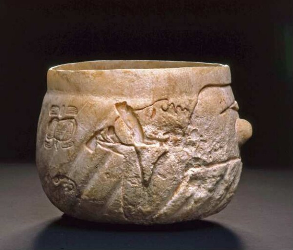 Stone vessel with reclining figure