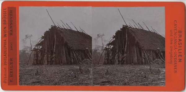 Groupe de personnes devant une cabane