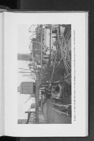 Loading a trainload of cable direct from cars into steamer, at a pier of the Hamburg-American Line, at Kuhwärder.