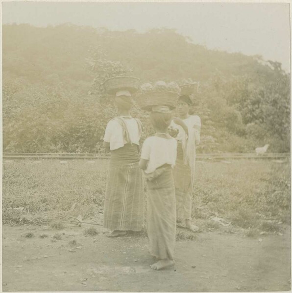 Women carrying baskets on their heads