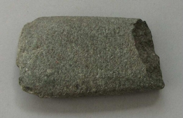 Stone axe blade (?)