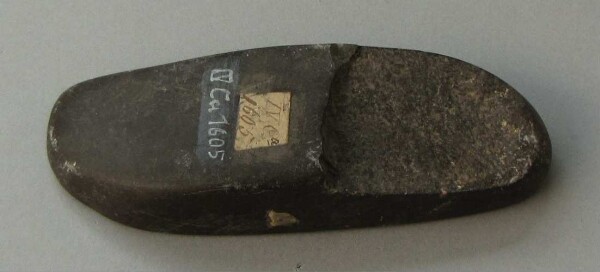 Stone axe blade (?)