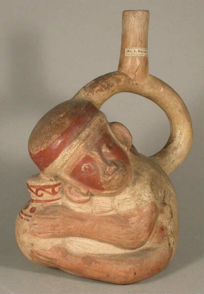 Figure vessel with stirrup spout