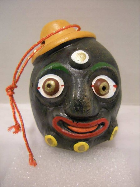 Bell in the shape of a miniature mask