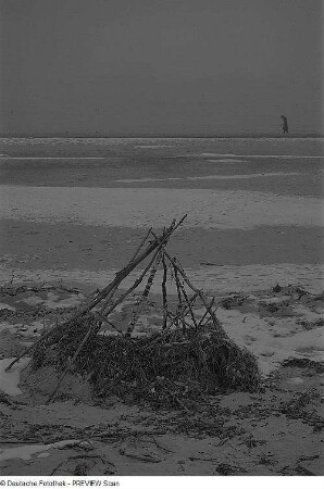 Strand mit Spaziergänger