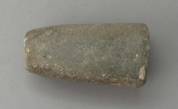 Stone axe blade (?)