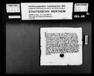 Hans Fleyschman und Margret, seine eheliche Wirtin, verkaufen dem Contz Snürlin und Else, seiner ehelichen Wirtin, einen Zins von 1 Pfund Wachs auf sein Haus an dem Pfarrhof zu Remlingen.