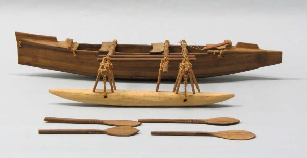 Model of an outrigger boat with accessories